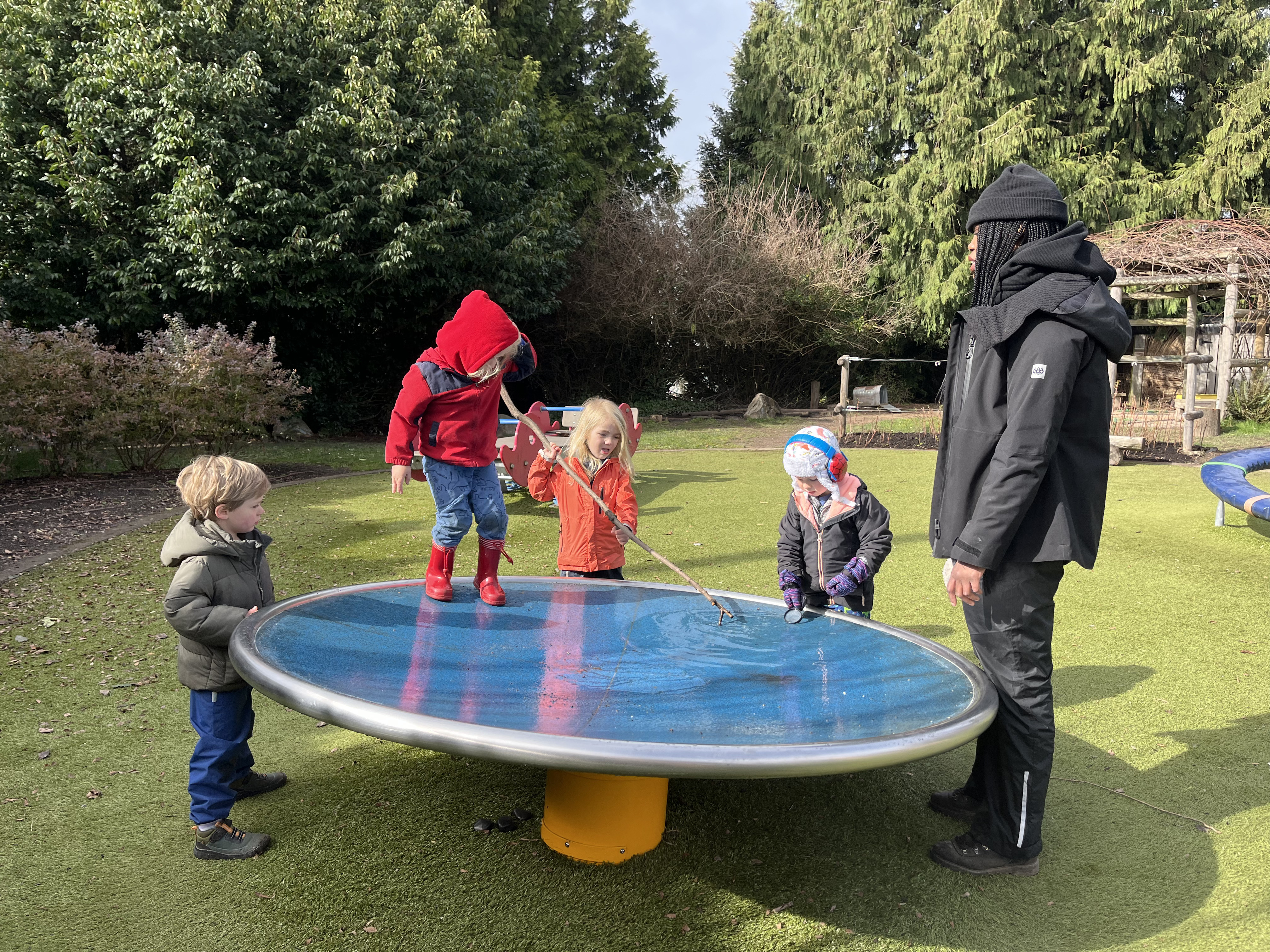 children playing on outdoor play equipment